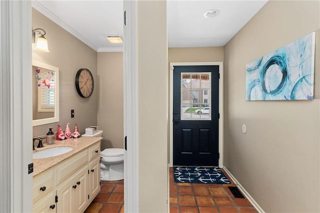 bathroom with vanity, tile patterned flooring, ornamental molding, and toilet