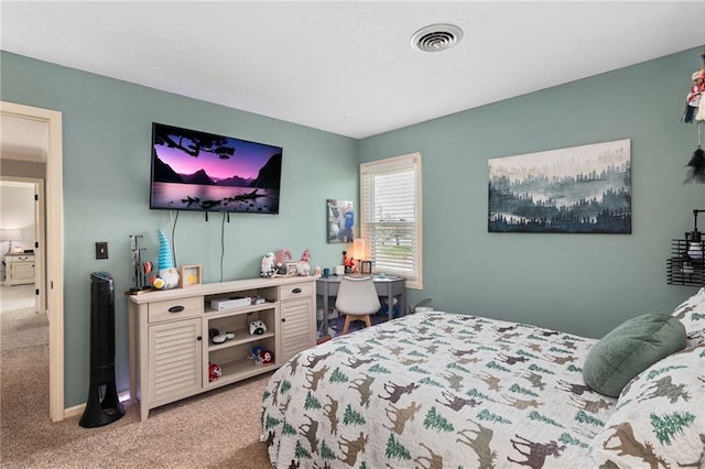 carpeted bedroom featuring visible vents and baseboards