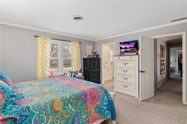 bedroom featuring light carpet, ensuite bathroom, visible vents, and crown molding