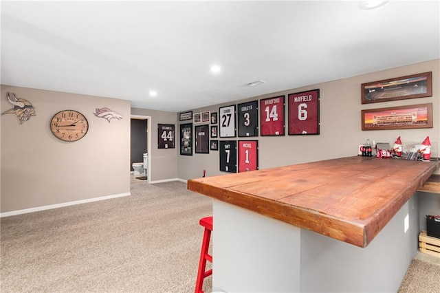 bar featuring recessed lighting, carpet, and baseboards