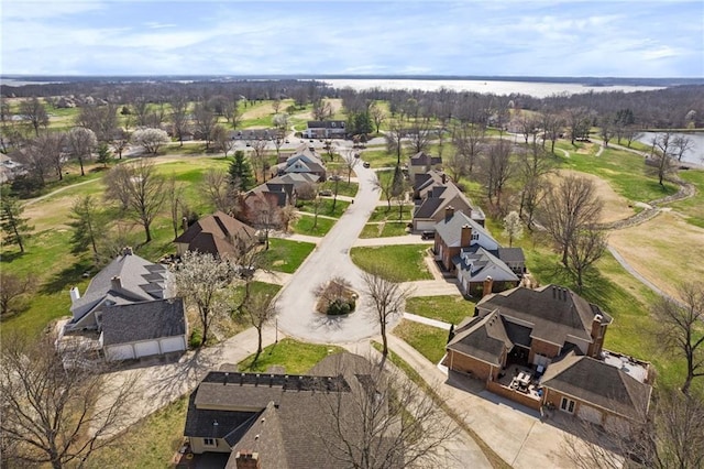 birds eye view of property featuring a residential view and a water view