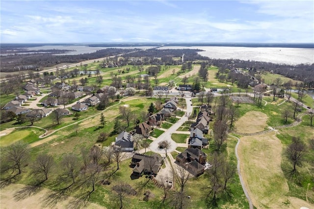 birds eye view of property featuring a water view and a residential view