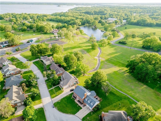 birds eye view of property featuring a water view and a residential view