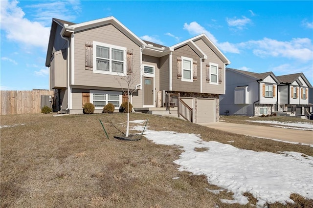 split foyer home with central AC and a garage