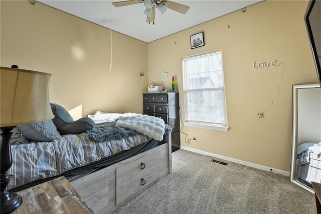 bedroom with carpet flooring, visible vents, baseboards, and ceiling fan