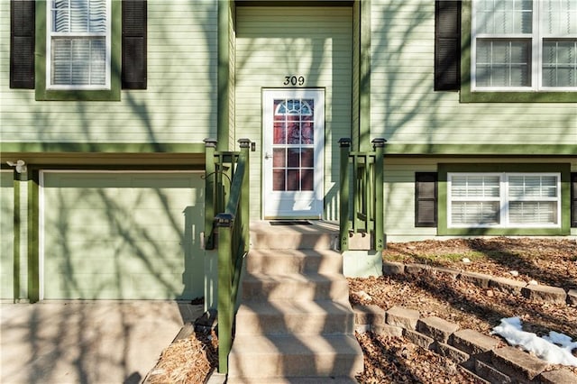 property entrance with a garage