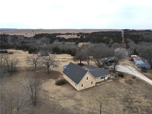 birds eye view of property with a rural view