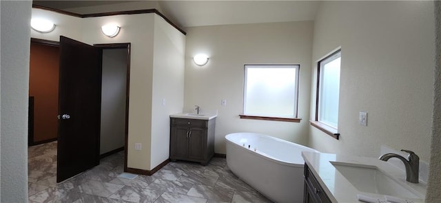 bathroom with vanity and a bathtub