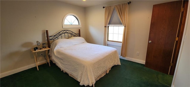 bedroom with dark carpet