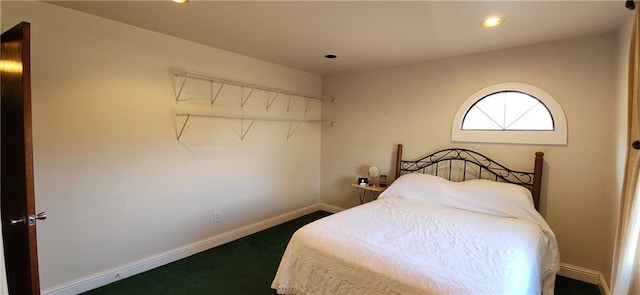bedroom featuring dark colored carpet