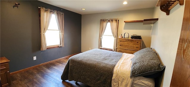 bedroom featuring dark hardwood / wood-style flooring