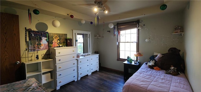 bedroom with dark wood-type flooring