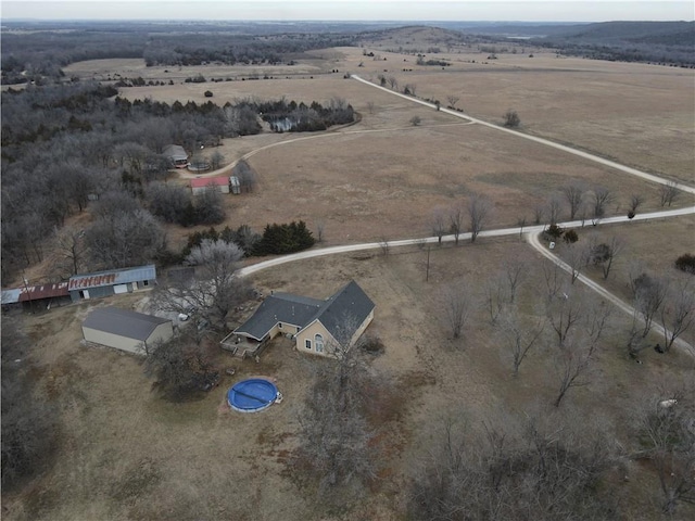 birds eye view of property with a rural view