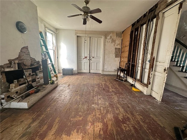 miscellaneous room featuring ceiling fan and dark hardwood / wood-style flooring