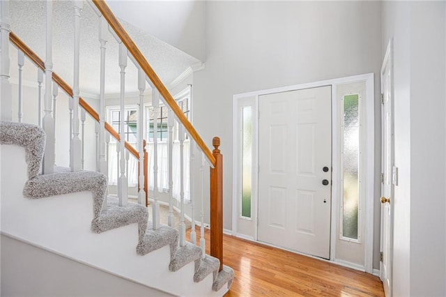 foyer entrance with light hardwood / wood-style floors