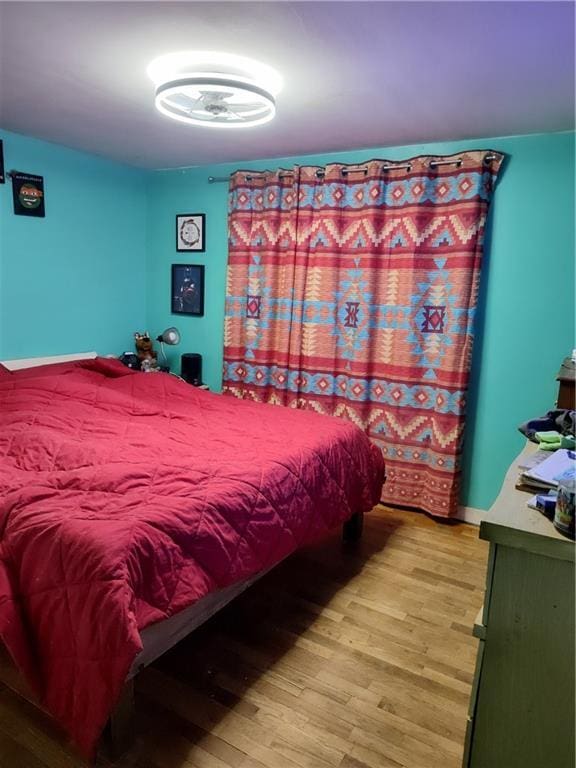 bedroom featuring wood finished floors