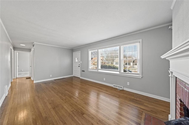 unfurnished living room featuring crown molding and dark hardwood / wood-style floors