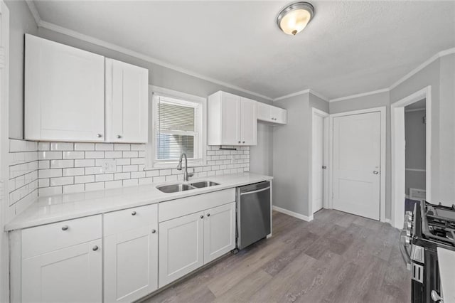 kitchen featuring sink, light hardwood / wood-style flooring, dishwasher, ornamental molding, and white cabinets