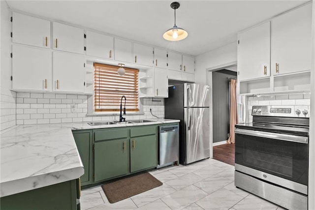 kitchen with sink, white cabinetry, green cabinetry, decorative light fixtures, and appliances with stainless steel finishes