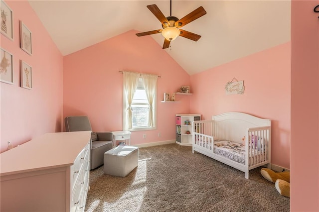 carpeted bedroom with a nursery area, ceiling fan, and lofted ceiling