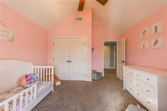 bedroom with ceiling fan, high vaulted ceiling, dark carpet, and a closet