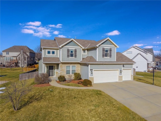 view of front of home featuring a garage and a front lawn