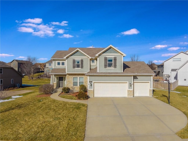 view of front of home with a garage and a front lawn