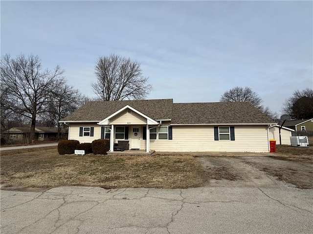 single story home with covered porch