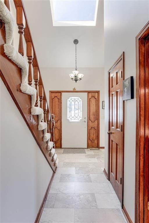 entryway with a chandelier and a high ceiling