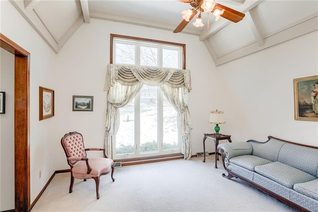 sitting room featuring beamed ceiling, ceiling fan, high vaulted ceiling, and carpet floors