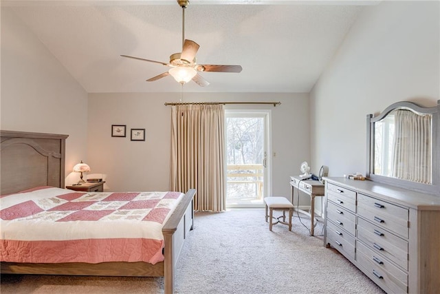 carpeted bedroom featuring ceiling fan, access to exterior, and vaulted ceiling