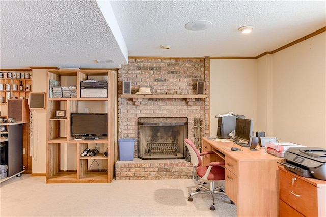 carpeted office space with ornamental molding, a textured ceiling, and a fireplace