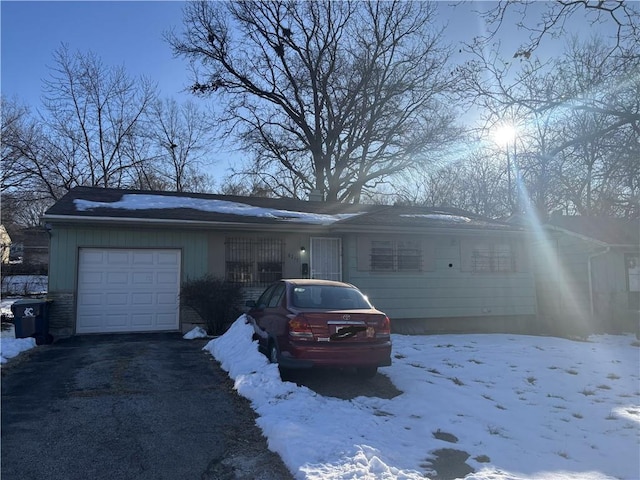 single story home with a garage