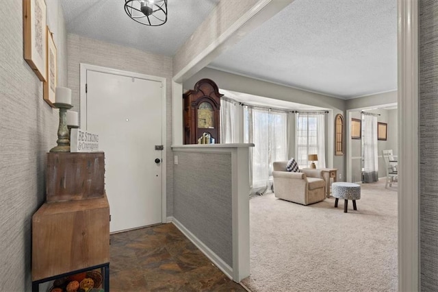 entryway featuring dark carpet and a textured ceiling