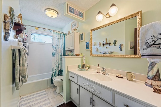 bathroom featuring a textured ceiling, tile patterned flooring, toilet, vanity, and shower / tub combo with curtain