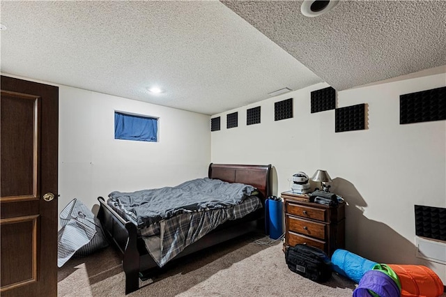 carpeted bedroom featuring a textured ceiling