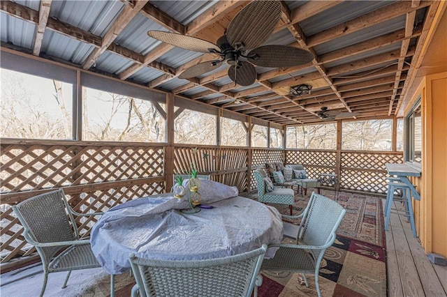 deck featuring ceiling fan and outdoor dining space