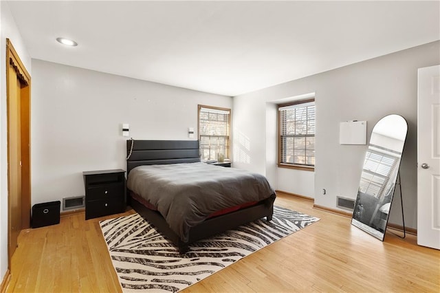 bedroom with light hardwood / wood-style floors