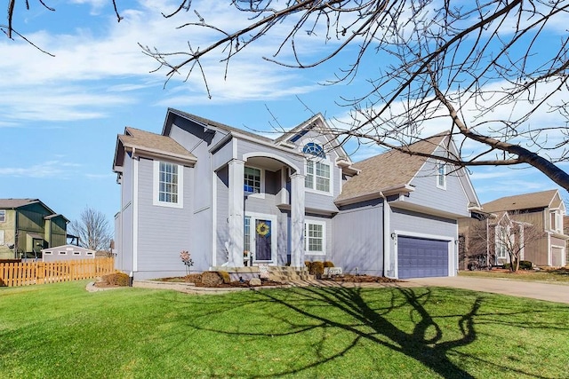 view of front of house with a garage and a front lawn