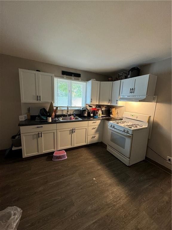 kitchen featuring sink, white cabinets, dark hardwood / wood-style floors, and white gas range oven