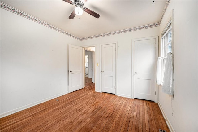 unfurnished bedroom featuring light hardwood / wood-style floors and ceiling fan