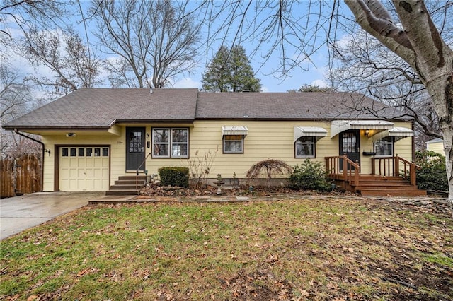 single story home with a garage and a front yard