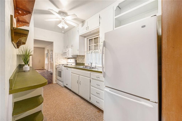 kitchen with white cabinetry, white appliances, sink, and decorative backsplash