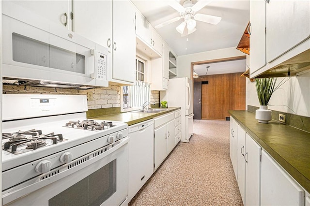 kitchen with sink, white cabinets, white appliances, and decorative backsplash