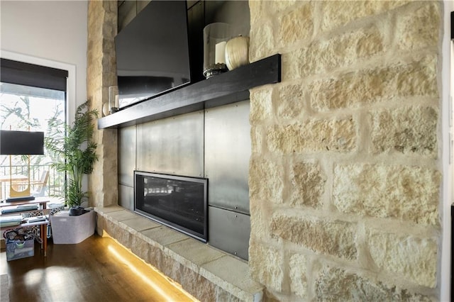 room details featuring hardwood / wood-style flooring and a fireplace