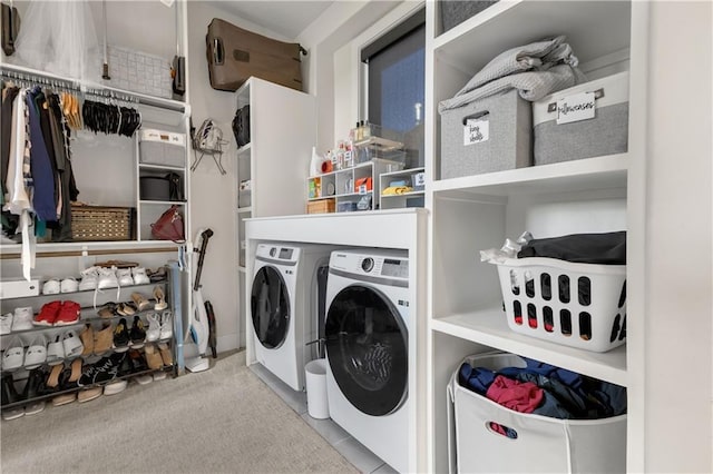 clothes washing area with independent washer and dryer