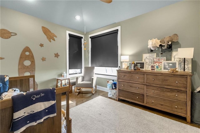 bedroom with dark wood-type flooring