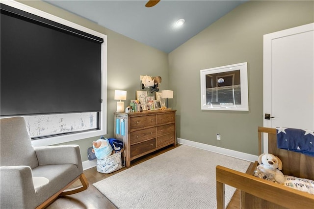 sitting room with hardwood / wood-style flooring and lofted ceiling