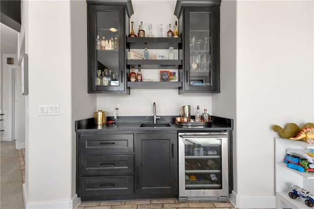 bar with wine cooler and sink