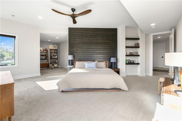 bedroom featuring ceiling fan and light carpet